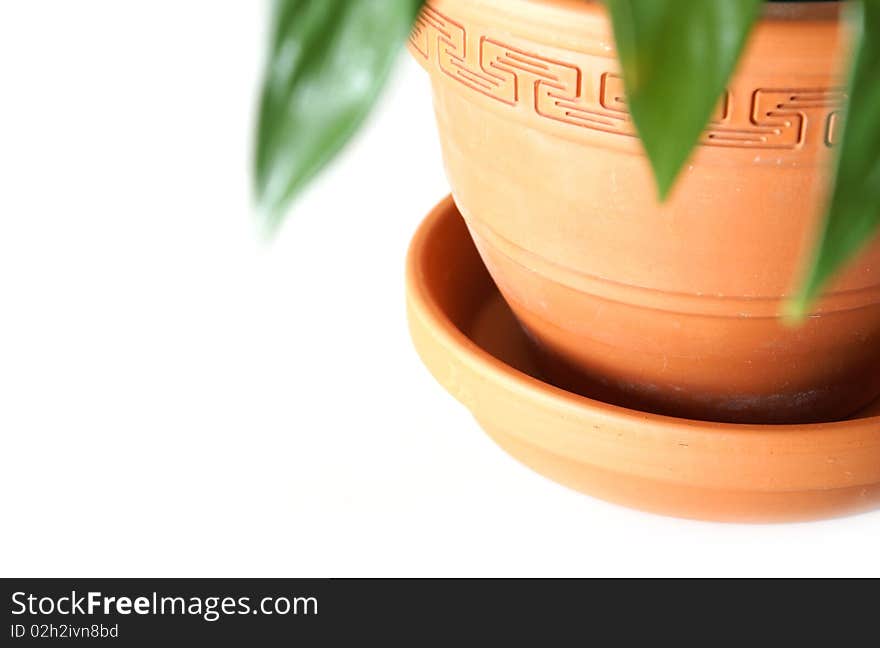 A closeup of a clay pot with the focus on it's details.