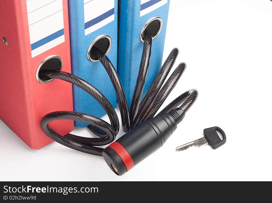 Three folders  linked  together with bicycle lock