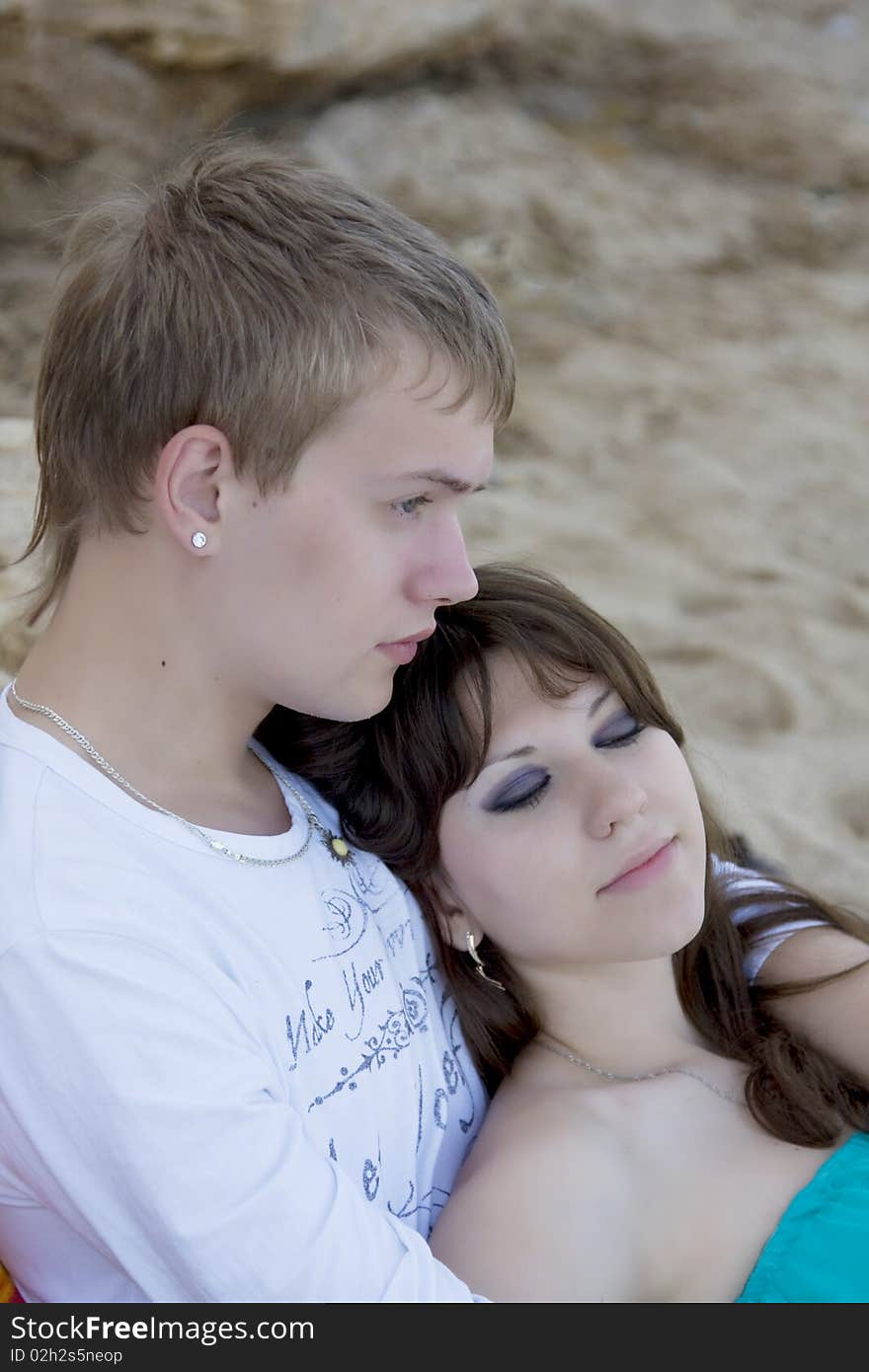 Yang man and woman enjoying themselves on the beach. Yang man and woman enjoying themselves on the beach