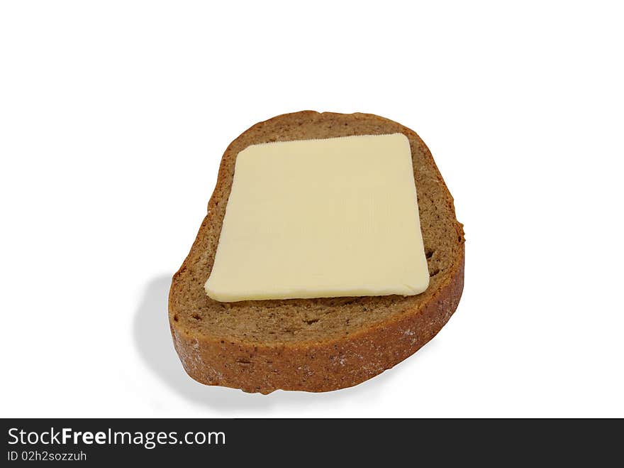 Black bread and butter on a white background