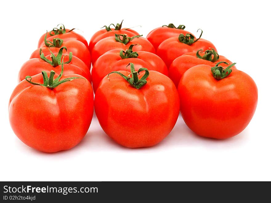 A few red tomatoes isolated on white. A few red tomatoes isolated on white