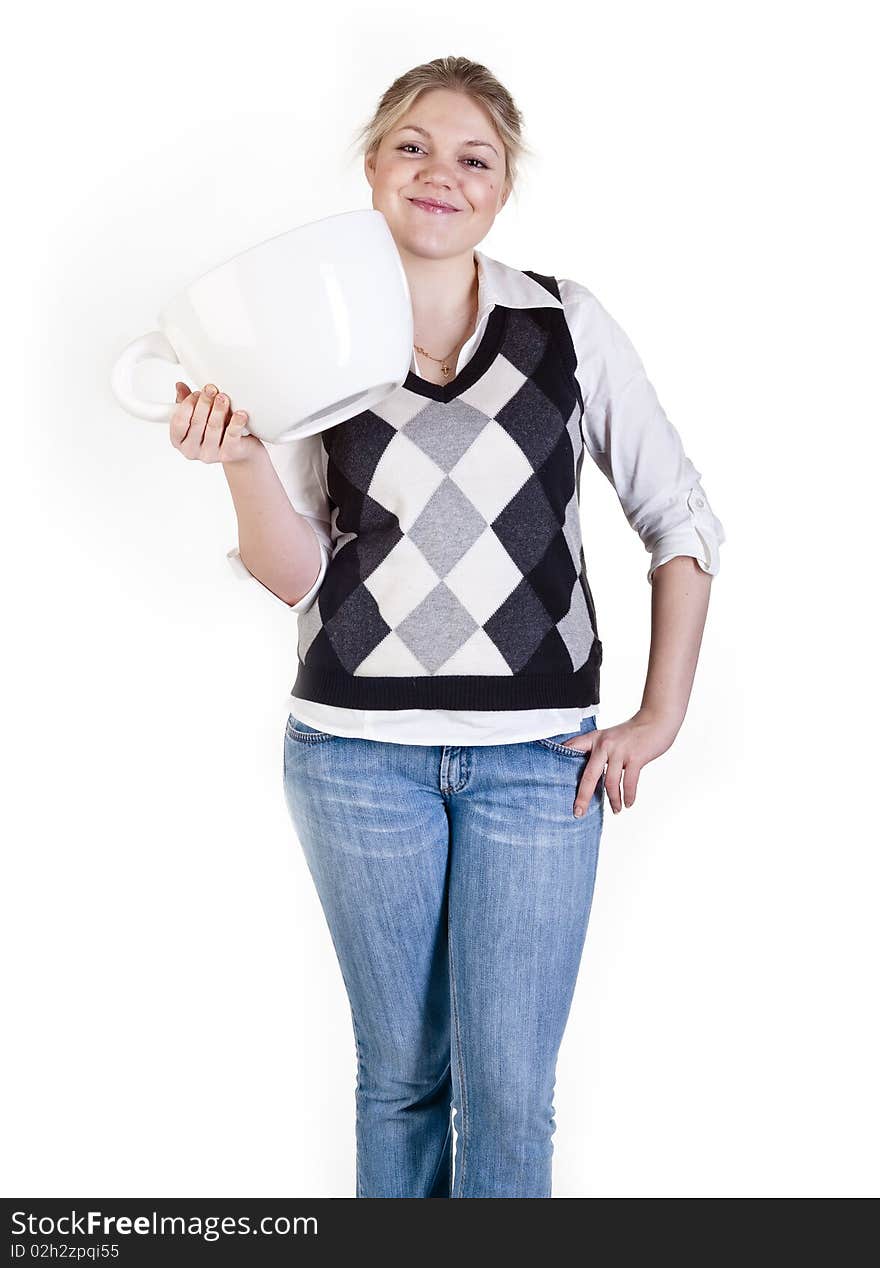 The beautiful young woman holding big coffee cup. The beautiful young woman holding big coffee cup