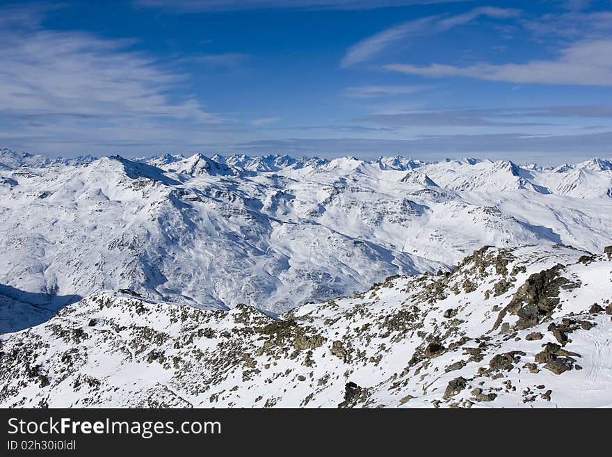 Sunny day on a mounting skiing resort in alps. Sunny day on a mounting skiing resort in alps