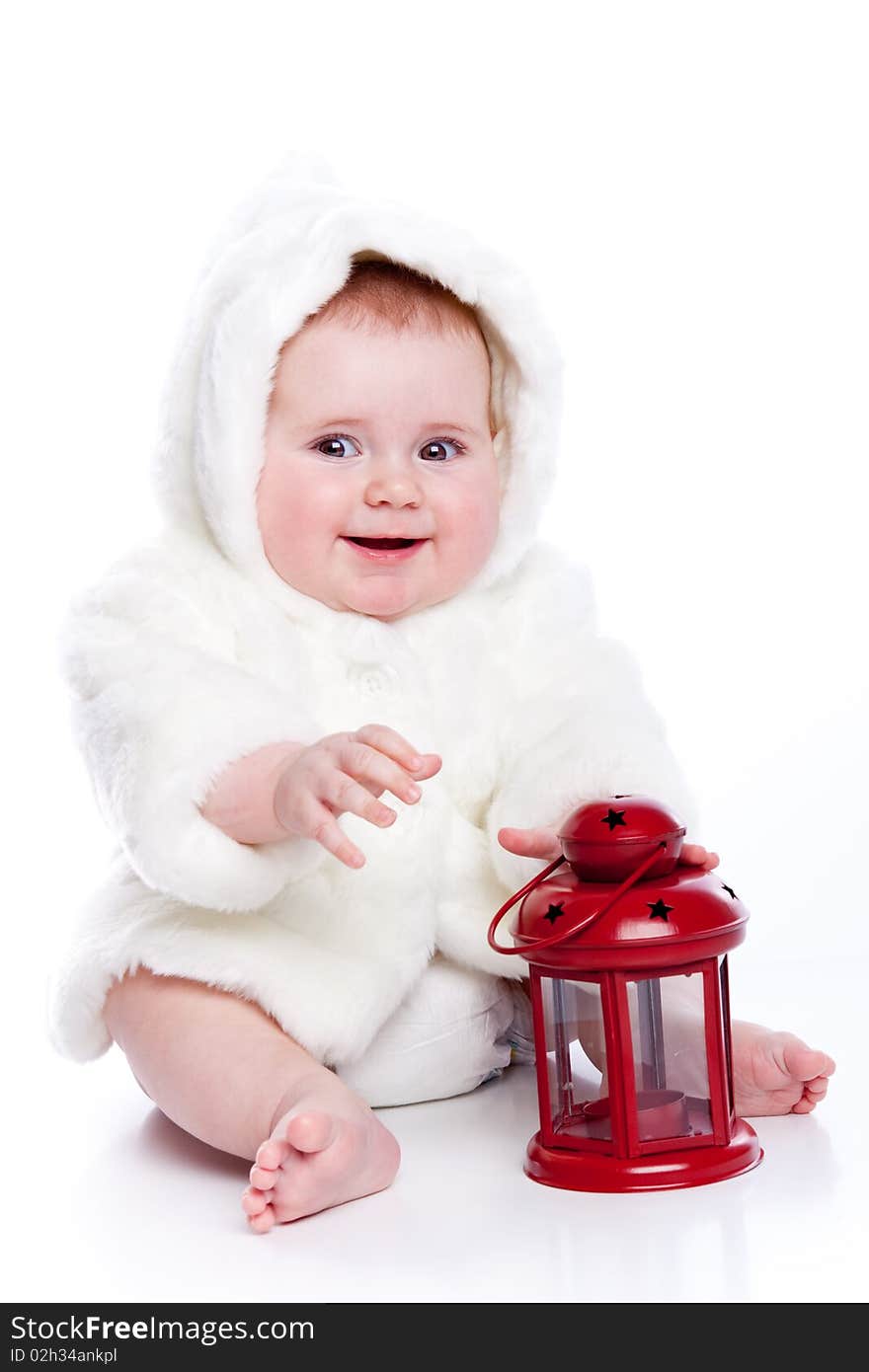 Cute little girl with a warm coat on white background