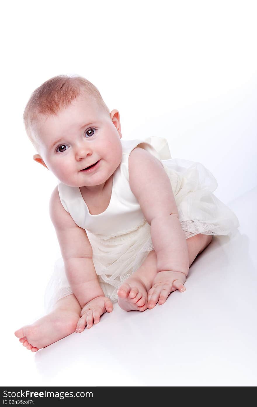 Very cute happy baby girl wearing princess dress