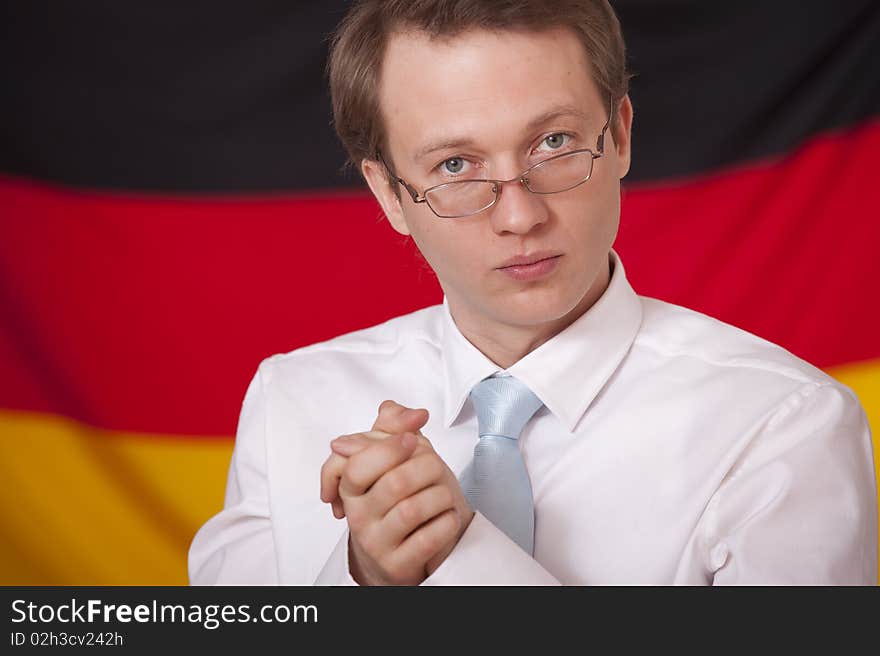 Economic cohesion - businessman in front of a german flag