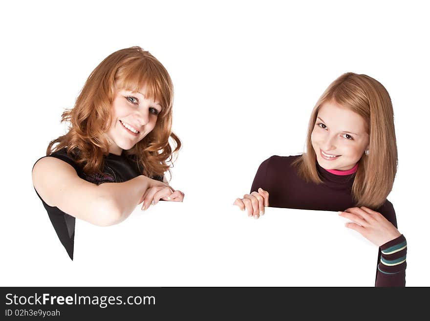 Two girls with white paper in hands. Isolated on white