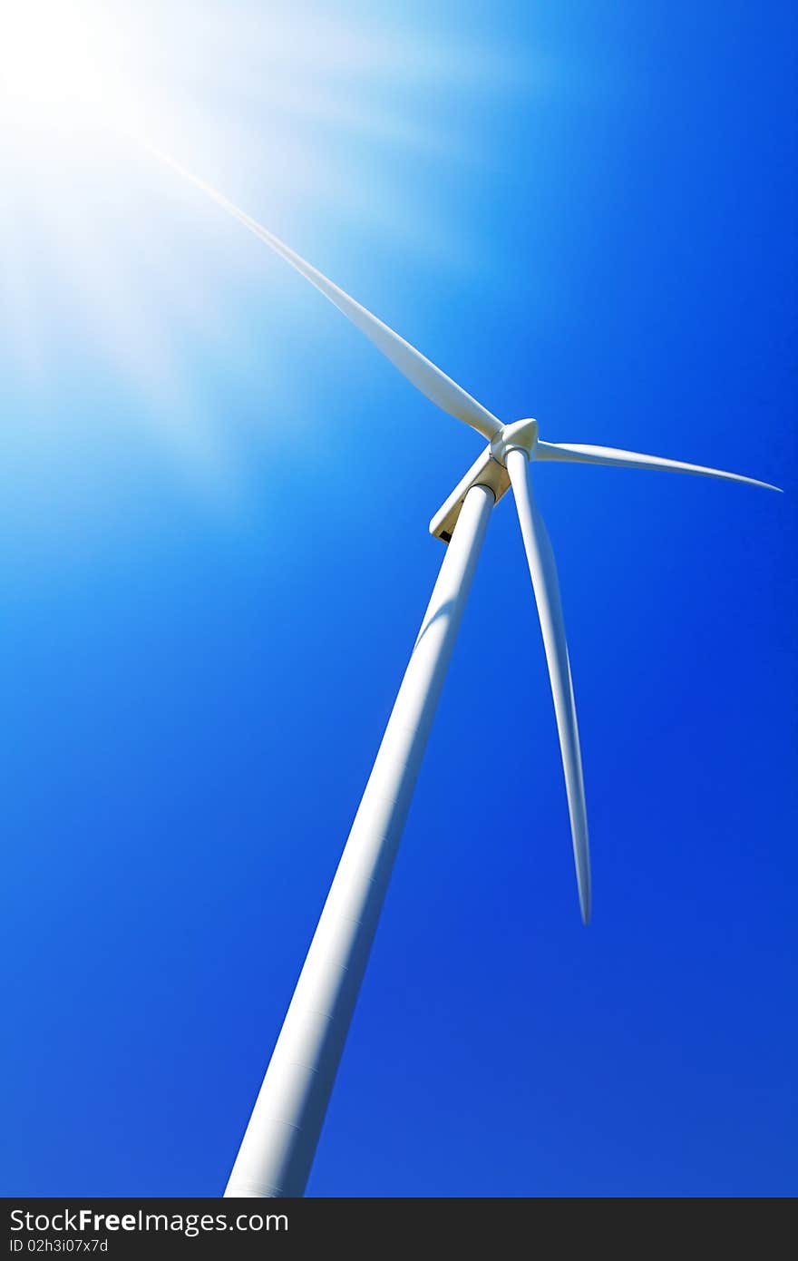 Wind turbine under clear blue sky