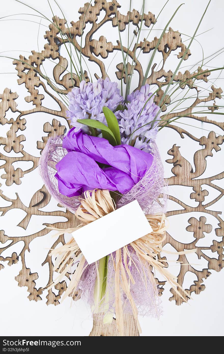 Bouquet of flowers with blank white card