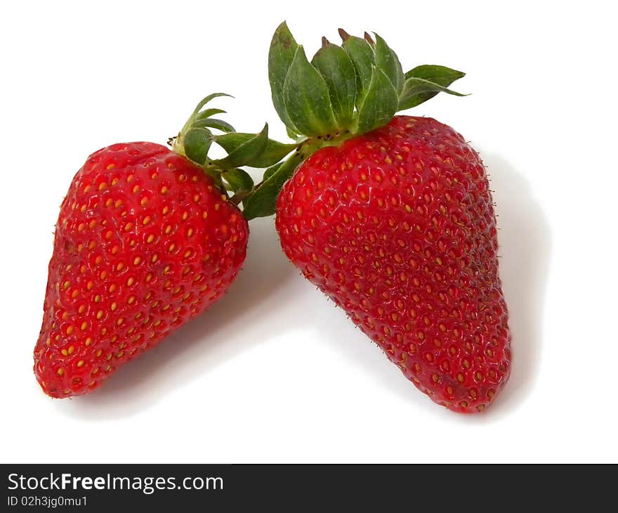 Two juicy ripe strawberries isolated on white background