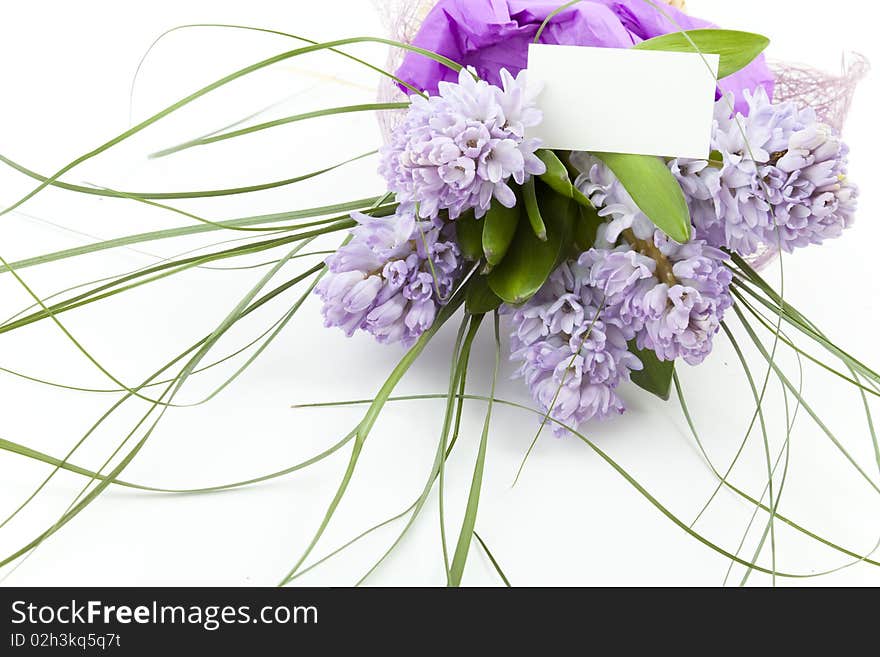 Bouquet of flowers with blank white card