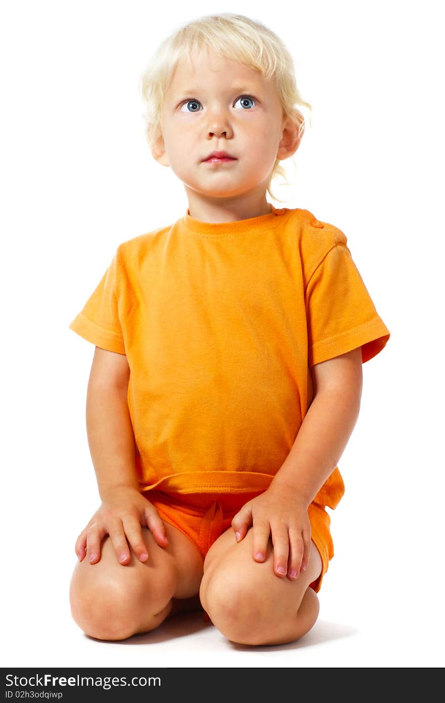 Cute little girl sitting over white