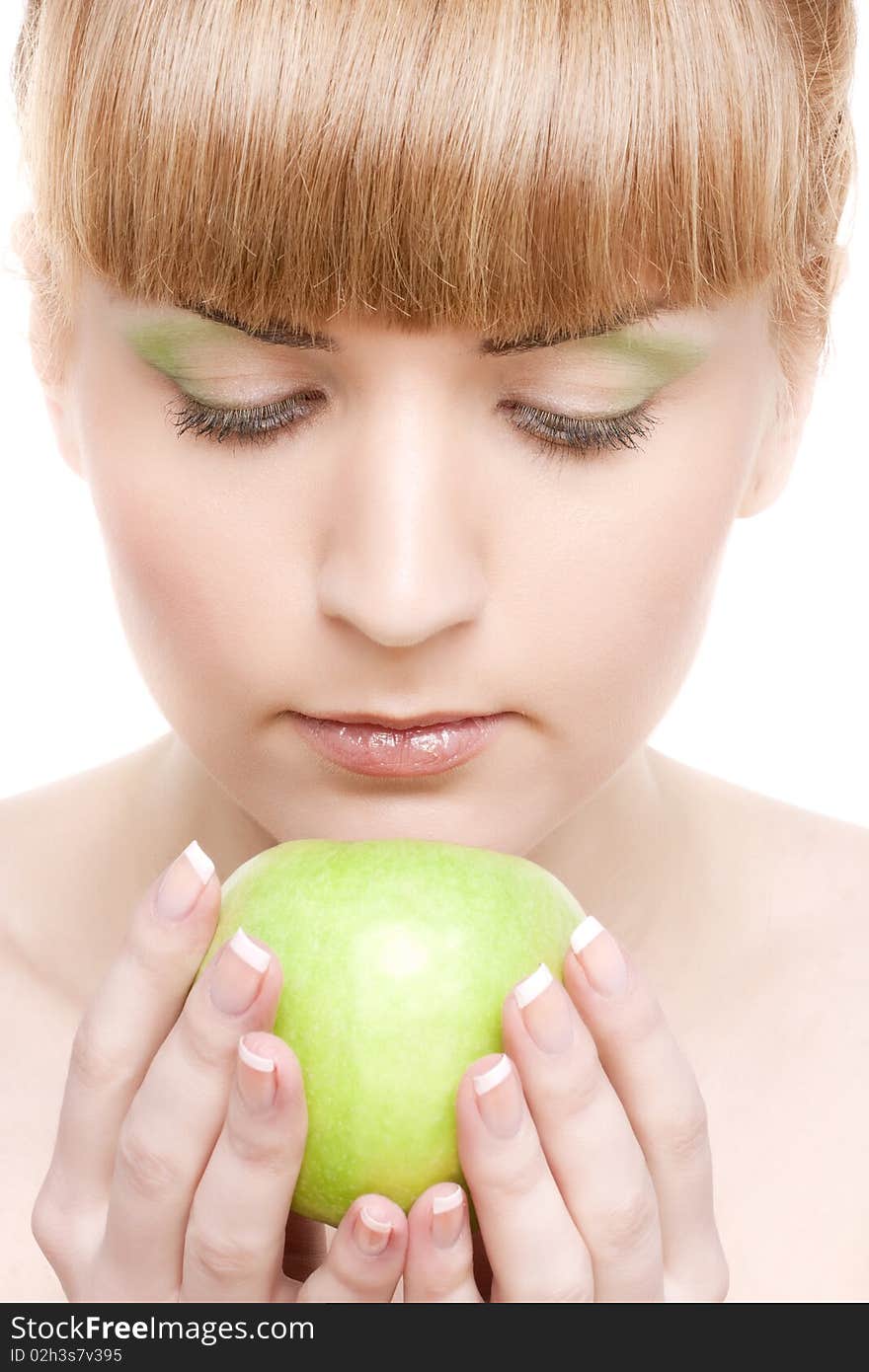 Beautiful smiling girl with green apple