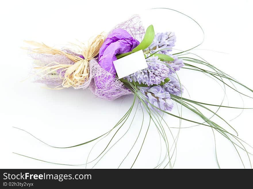 Bouquet of flowers with blank white card