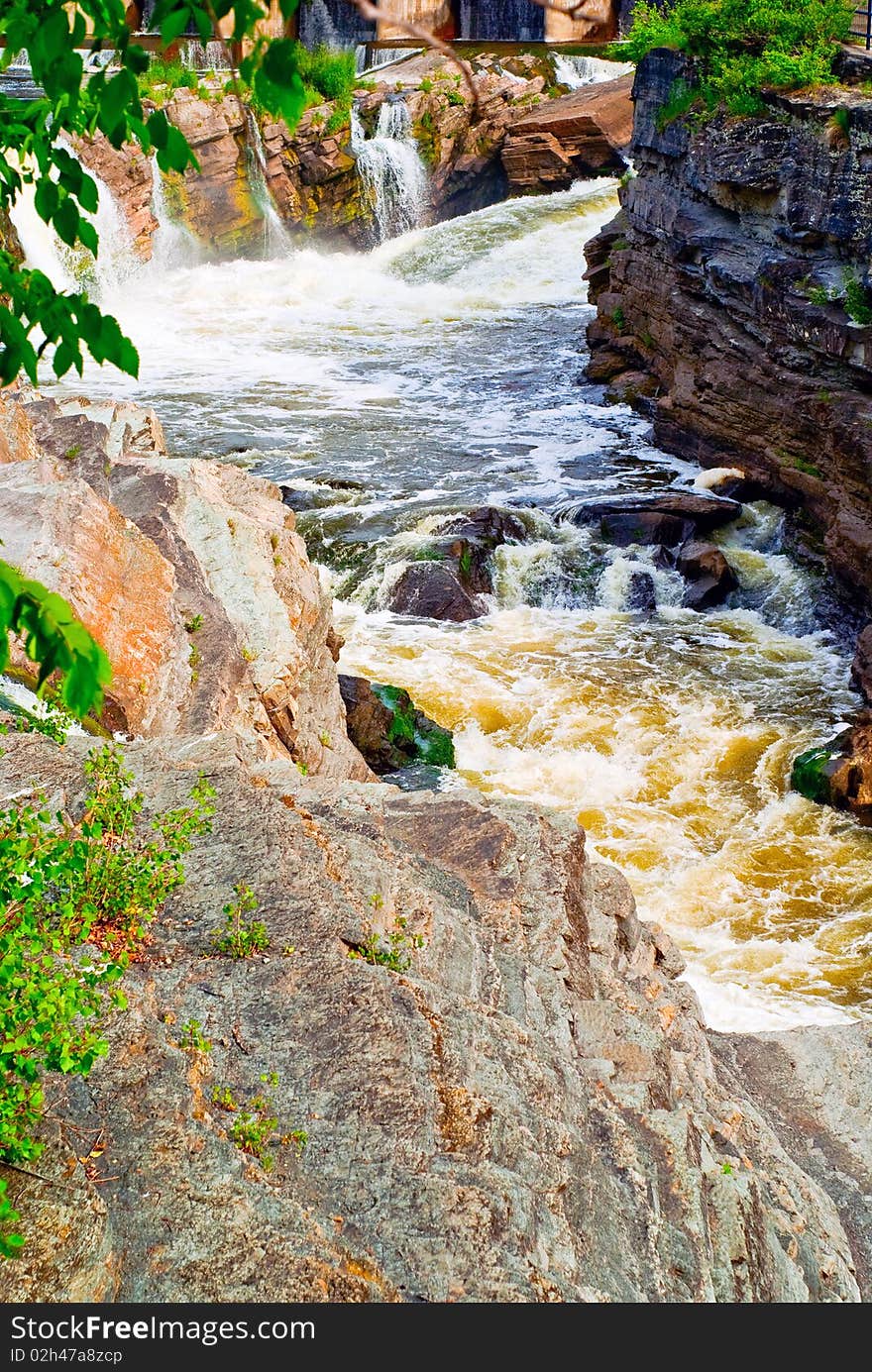 A violent, gushing rapids cut through a geological formation known as a hog's back. A violent, gushing rapids cut through a geological formation known as a hog's back