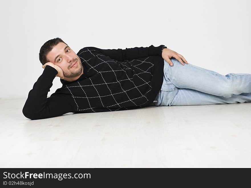 Cool man lying down on floor