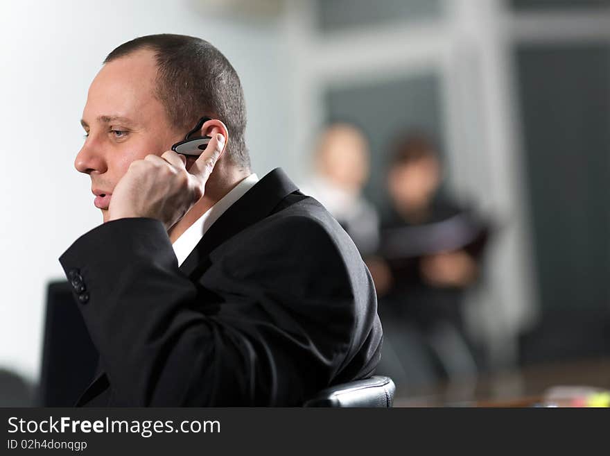 Man in black jacket on chair