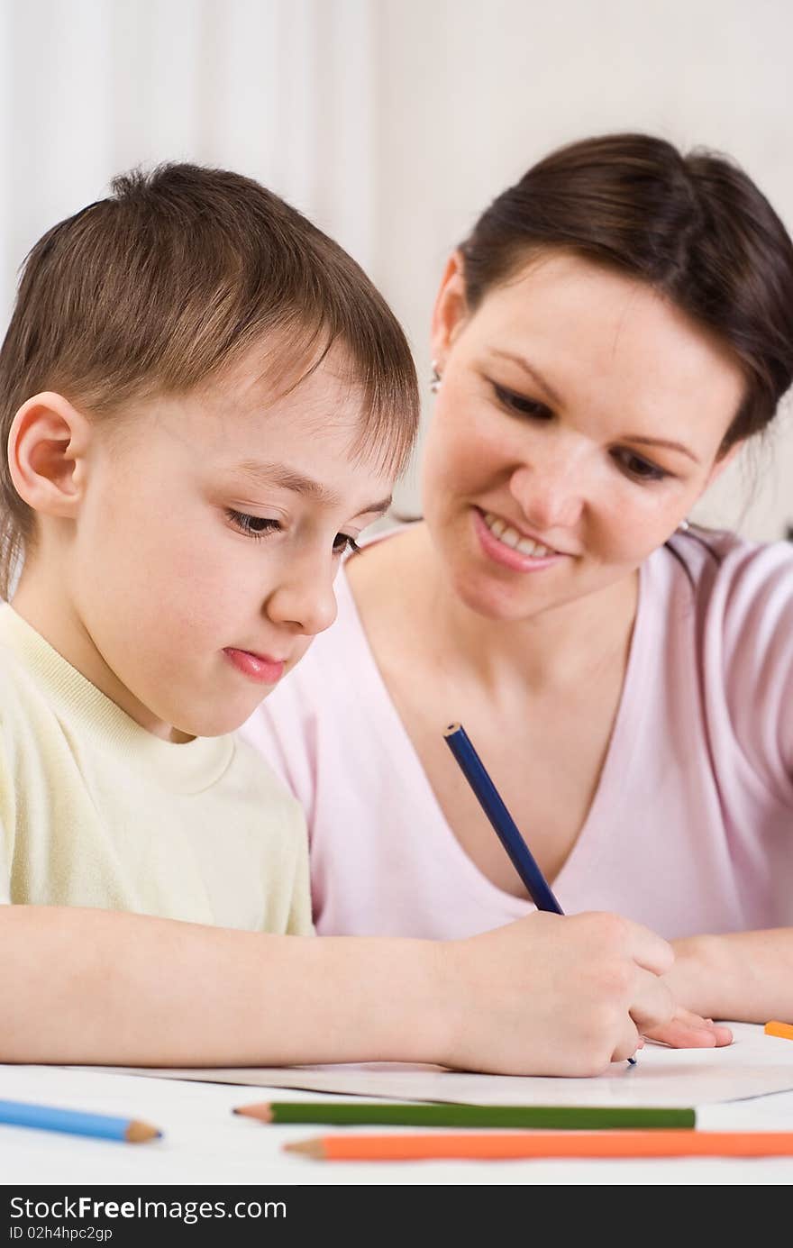 Handsome boy draws near with his mother