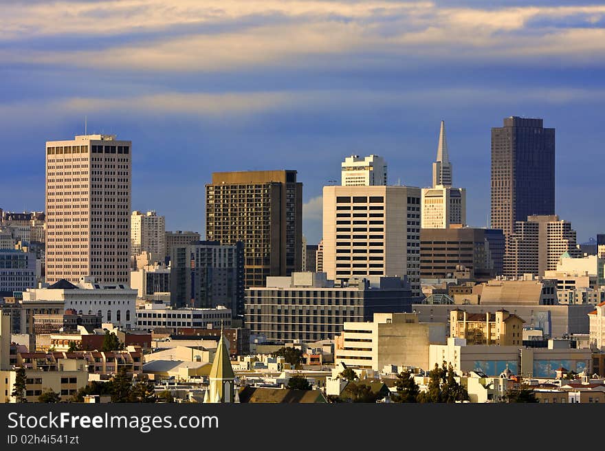 San Francisco downtown buildings at sunset. San Francisco downtown buildings at sunset.