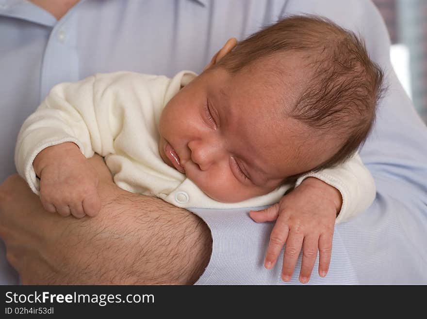 Dad keeps on his hands newborn daughter. Dad keeps on his hands newborn daughter