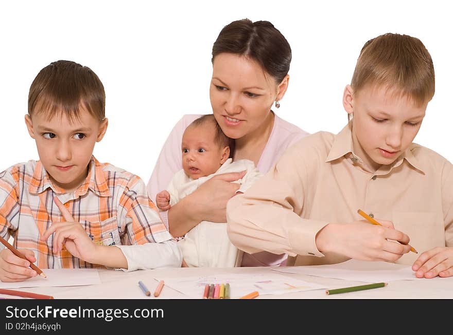 Young mother with two sons and newborn at home