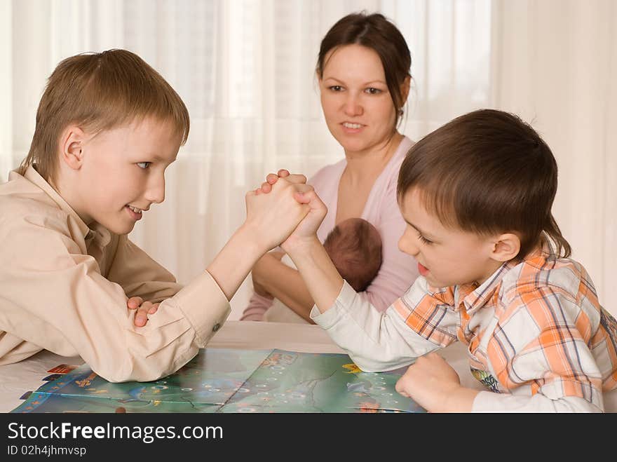 Mother with two sons and a newborn resting