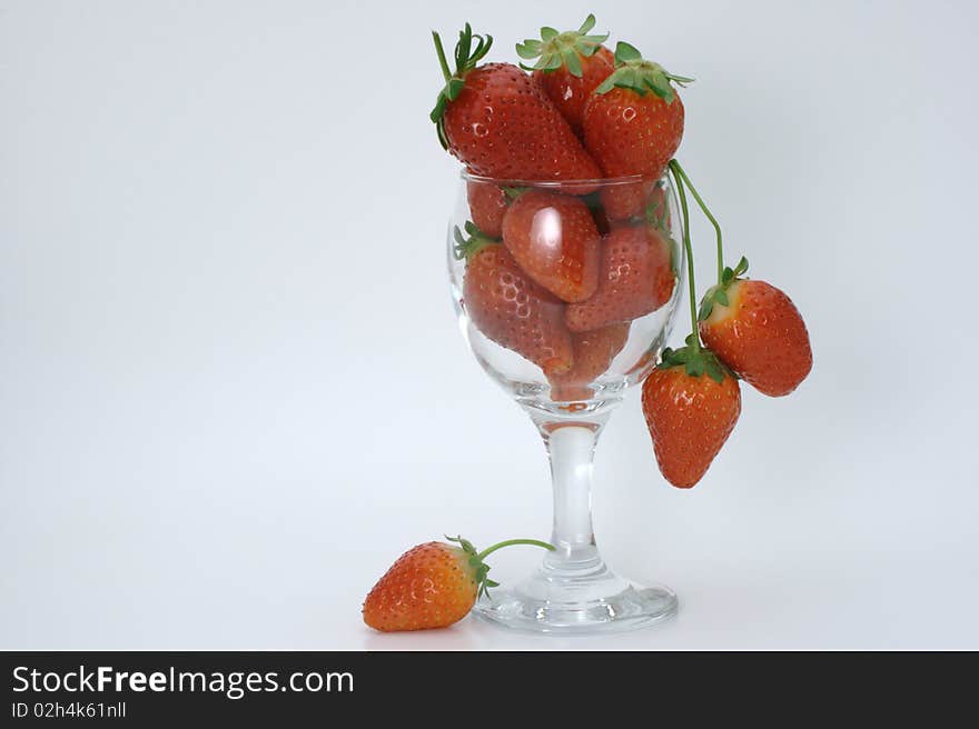 Wine glass filled to the top with strawberries