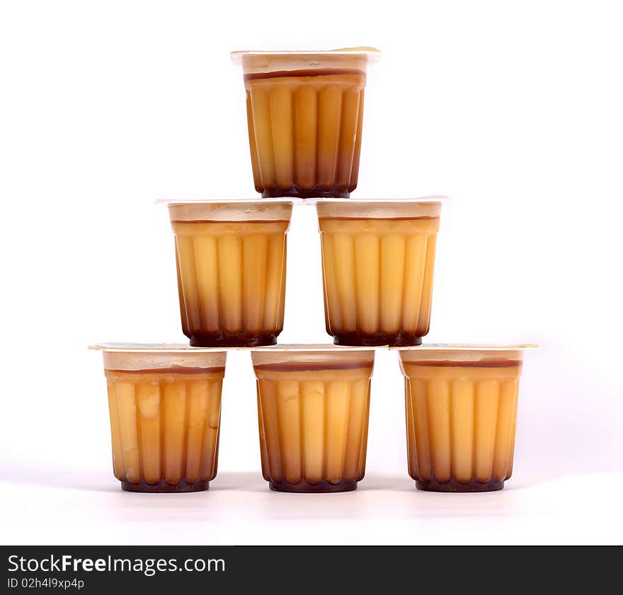 Various puddings piled on a white background. Various puddings piled on a white background