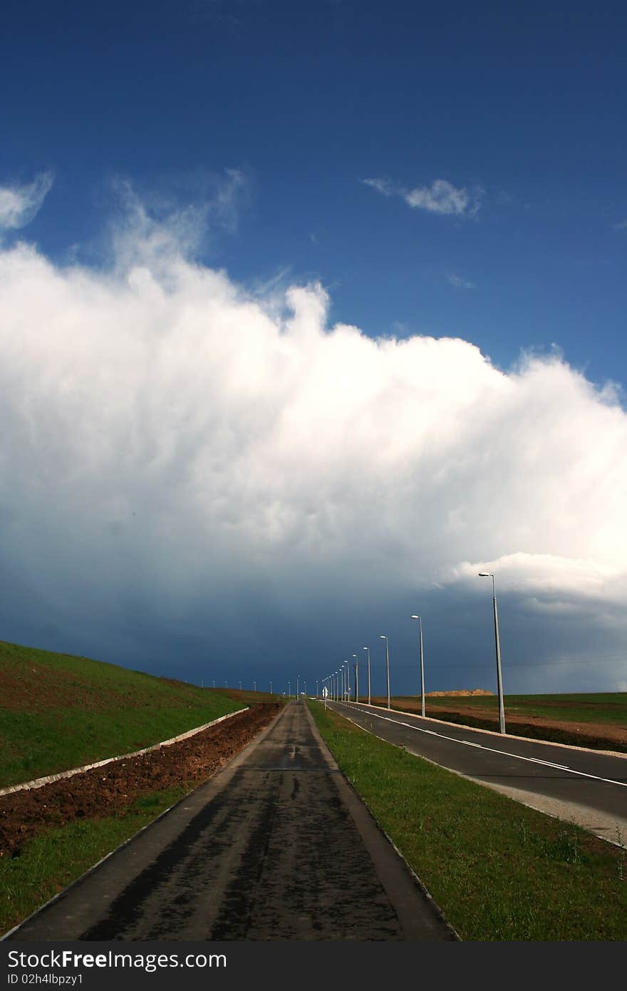 Landscape with road and storm clouds