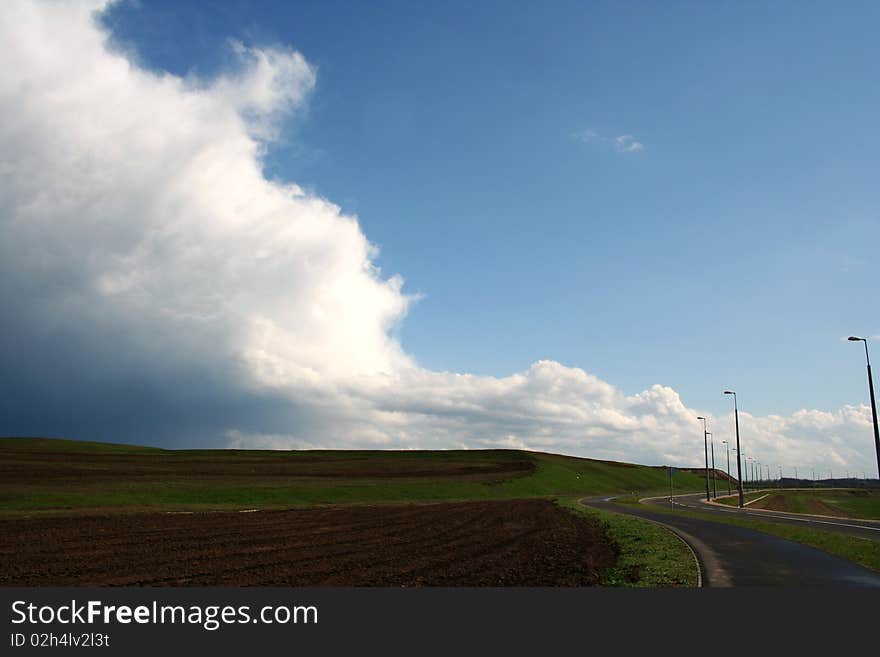 Landscape with road and storm clouds