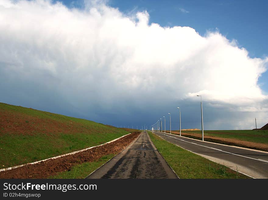 Landscape with road and storm clouds