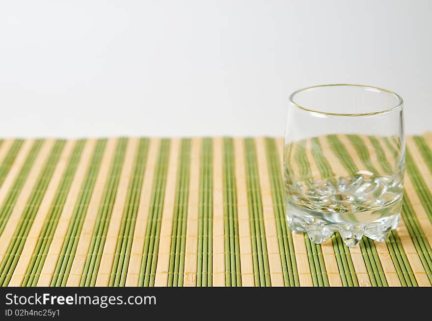 Clean empty glass on stripe surface