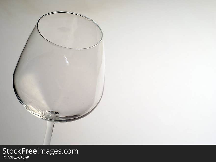 An empty glass of wine on a white background