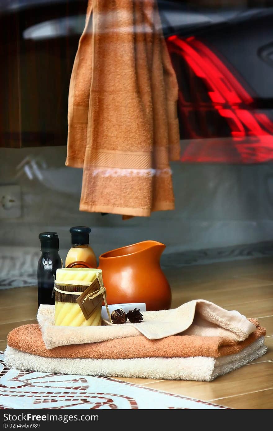 Spa items - towel, candles and stones. Spa items - towel, candles and stones