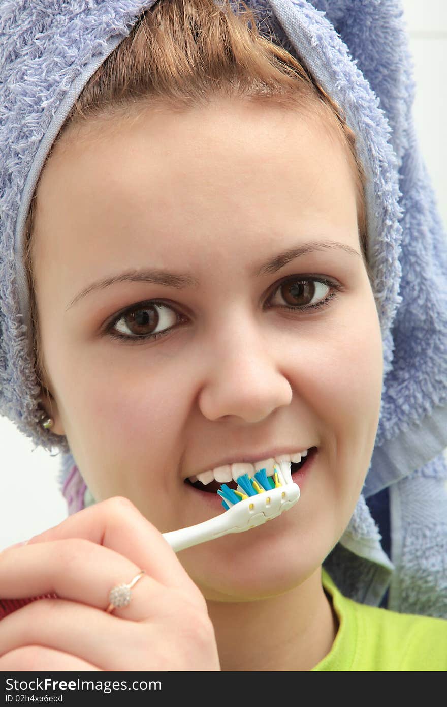 Young woman end toothbrush