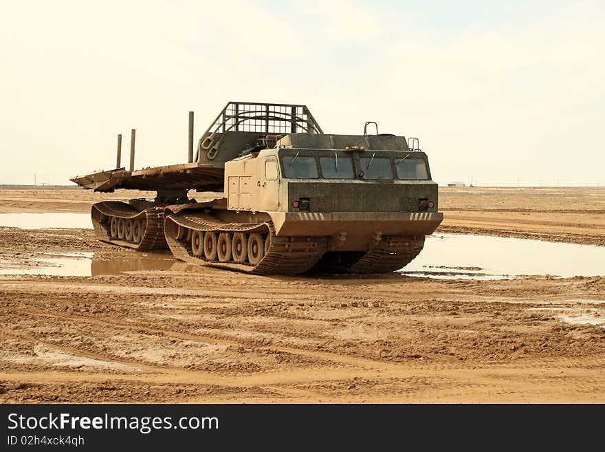 A powerful army truck all-terrain vehicle. Close-up. Day. A powerful army truck all-terrain vehicle. Close-up. Day.