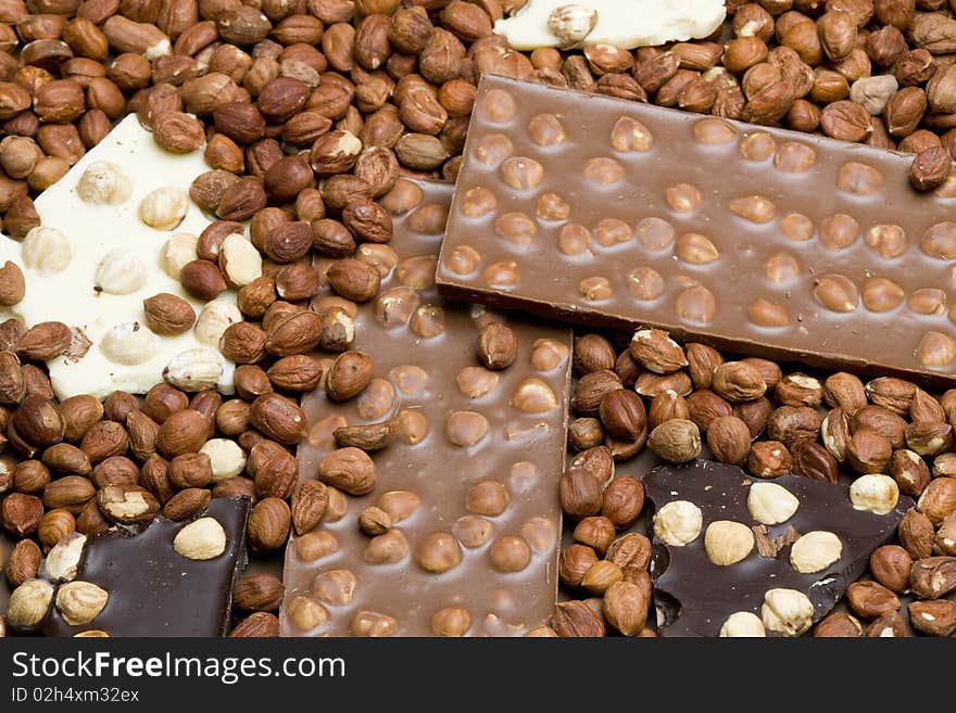 Still life of chocolate bars with hazelnuts