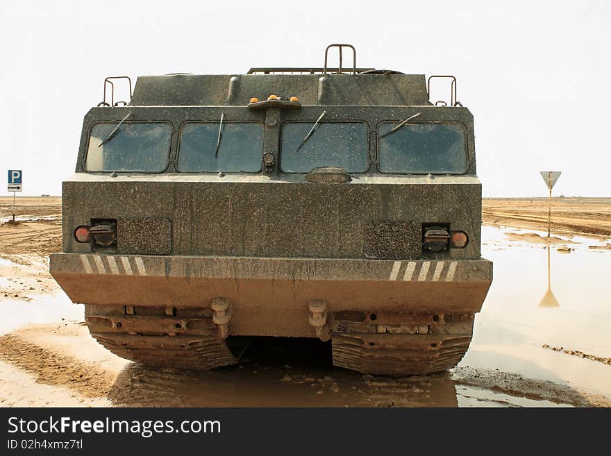 A powerful army truck all-terrain vehicle. Close-up. Day. A powerful army truck all-terrain vehicle. Close-up. Day.