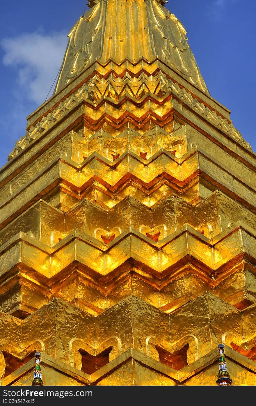 Golden Chedi at Wat Phra Kaew on outdoor sky. Golden Chedi at Wat Phra Kaew on outdoor sky.