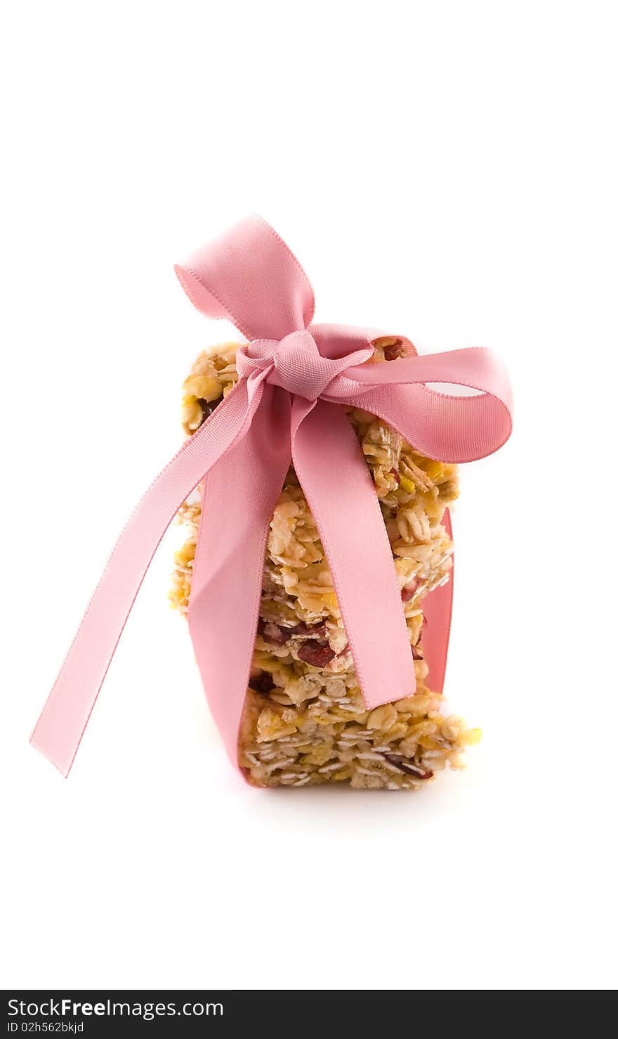 Muesli bar with pink bow on a white background