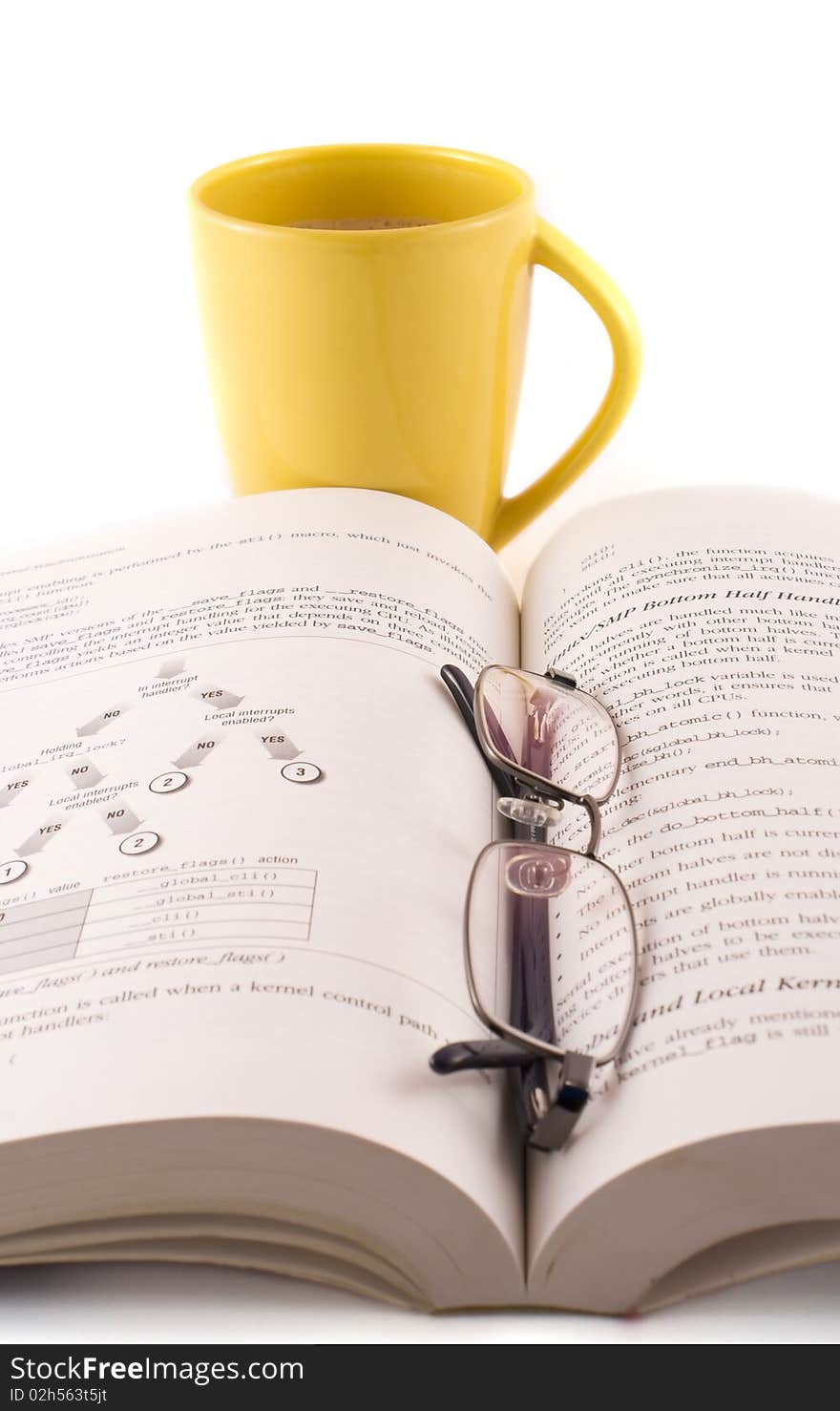 Yellow cup of coffee with a book and glasses