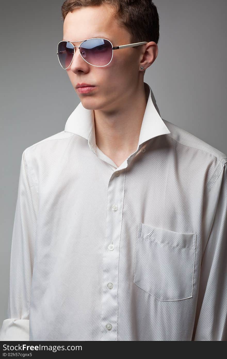 Portrait of young handsome man in sunglasses