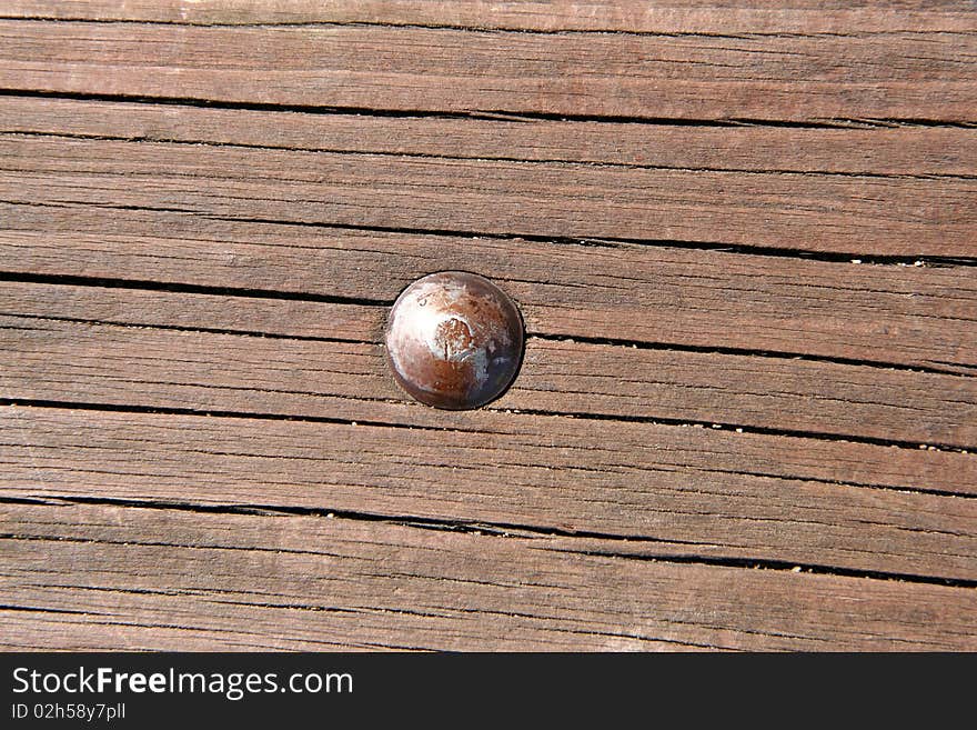 A Wooden texture background with a bolt