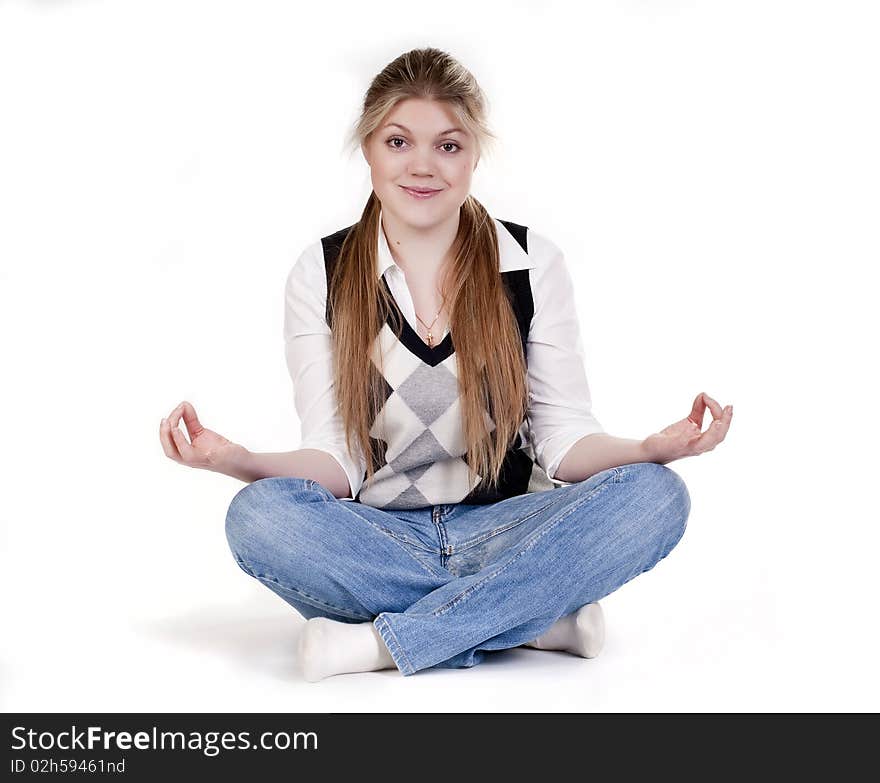 Blond woman meditating in lotus position isolated on white