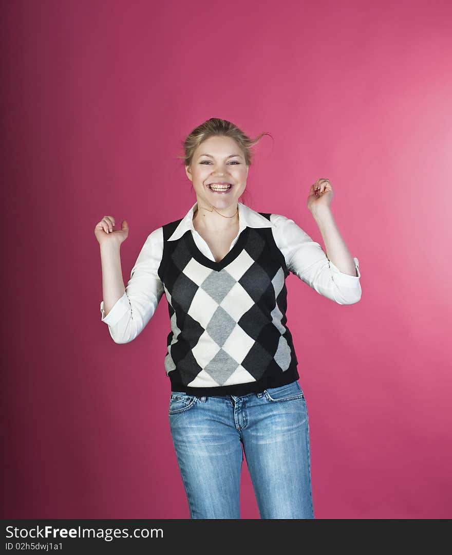 Woman with blond long hair and happy smiling facial expression jumping up. Woman with blond long hair and happy smiling facial expression jumping up