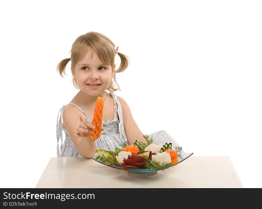 Little girl eating vegetables - isolated