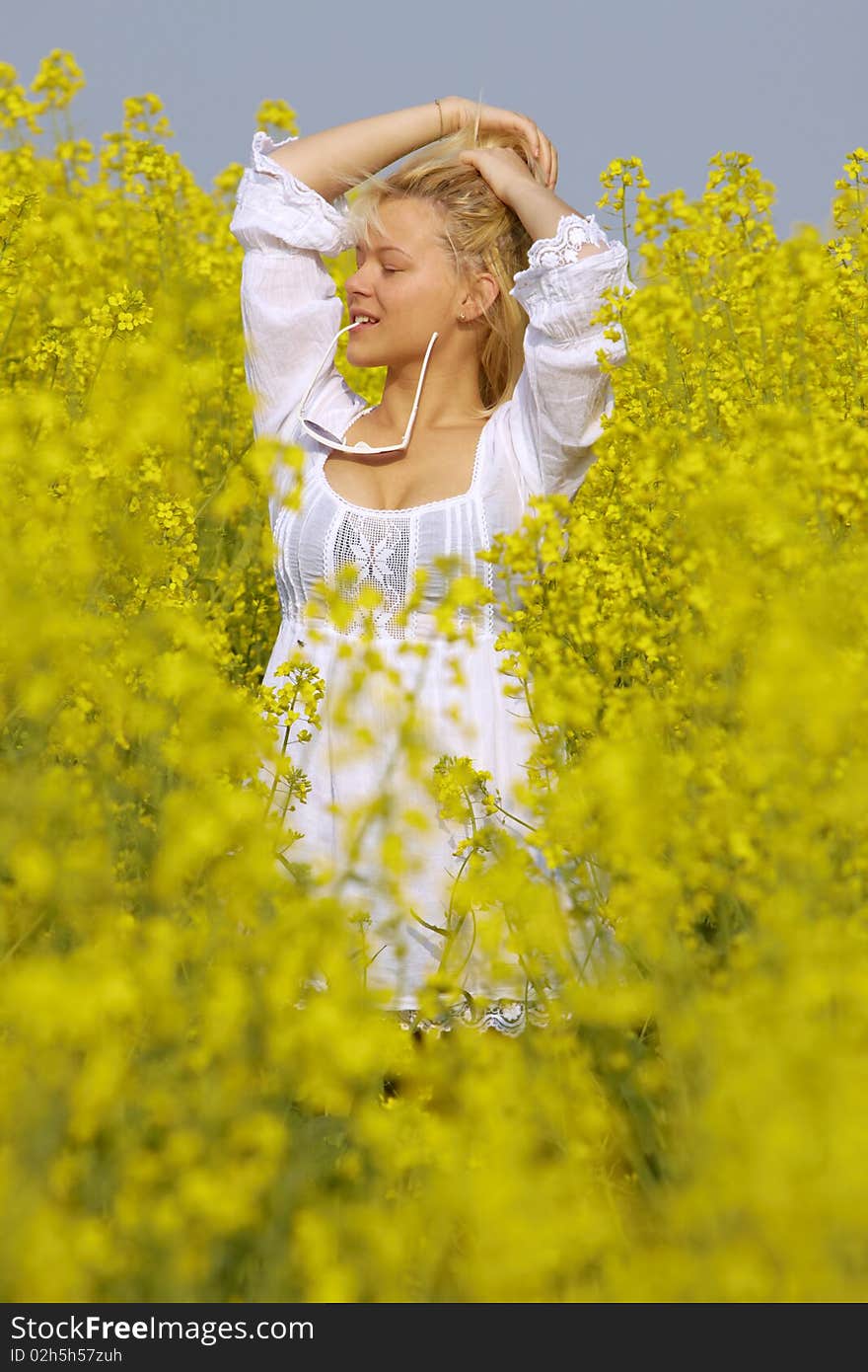 Blonde sexy Girl in the flower Rape Field