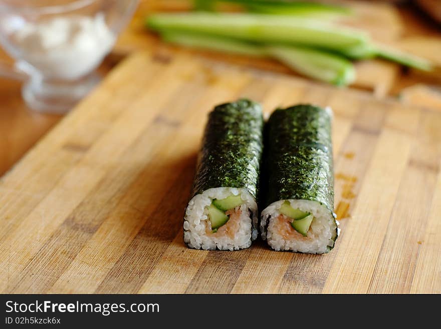 An image of two rolls on wooden plate