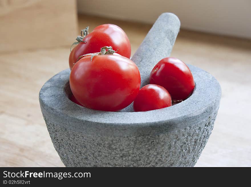 Tomatos In A Pestle And Mortar