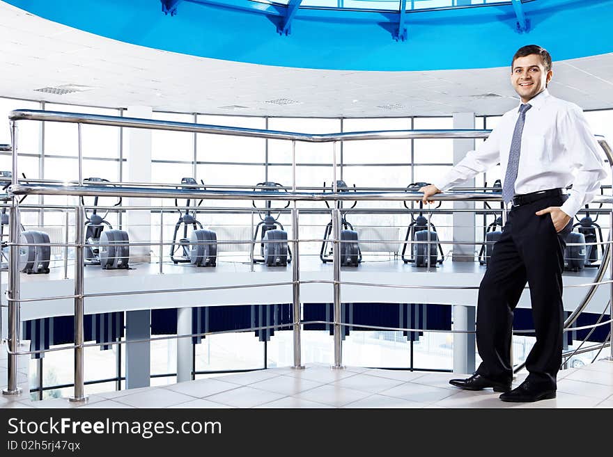 The young man in a suit in a sports hall. The young man in a suit in a sports hall